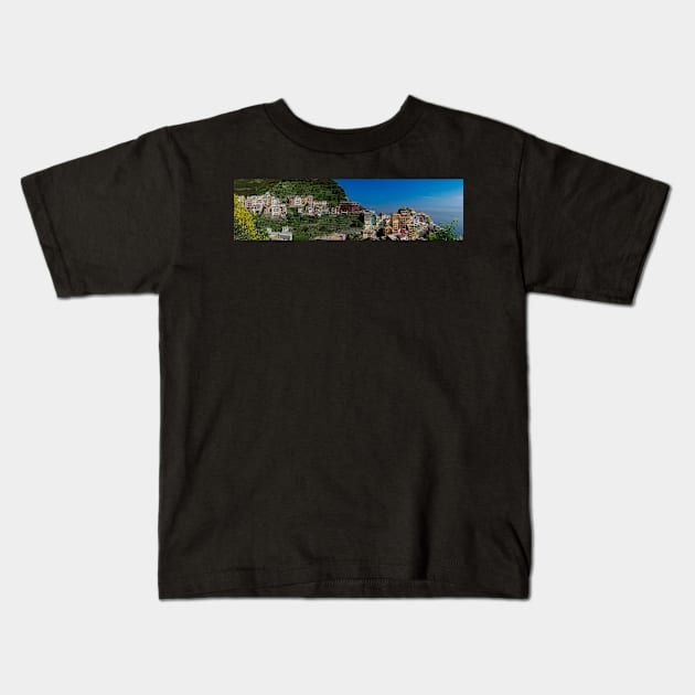 View on the cliff town of Manarola, one of the colorful Cinque Terre on the Italian west coast Kids T-Shirt by Dolfilms